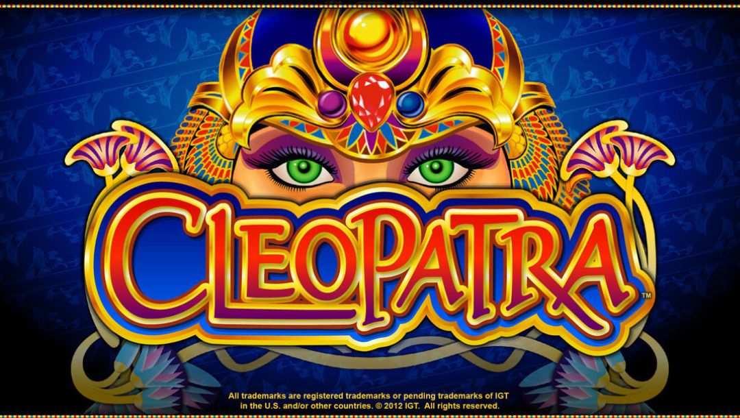 The title screen for the Cleopatra slot game, features a green-eyed depiction of Cleopatra wearing an ornate headdress and peering over the game logo which is surrounded by 2D flowers framed in gold.