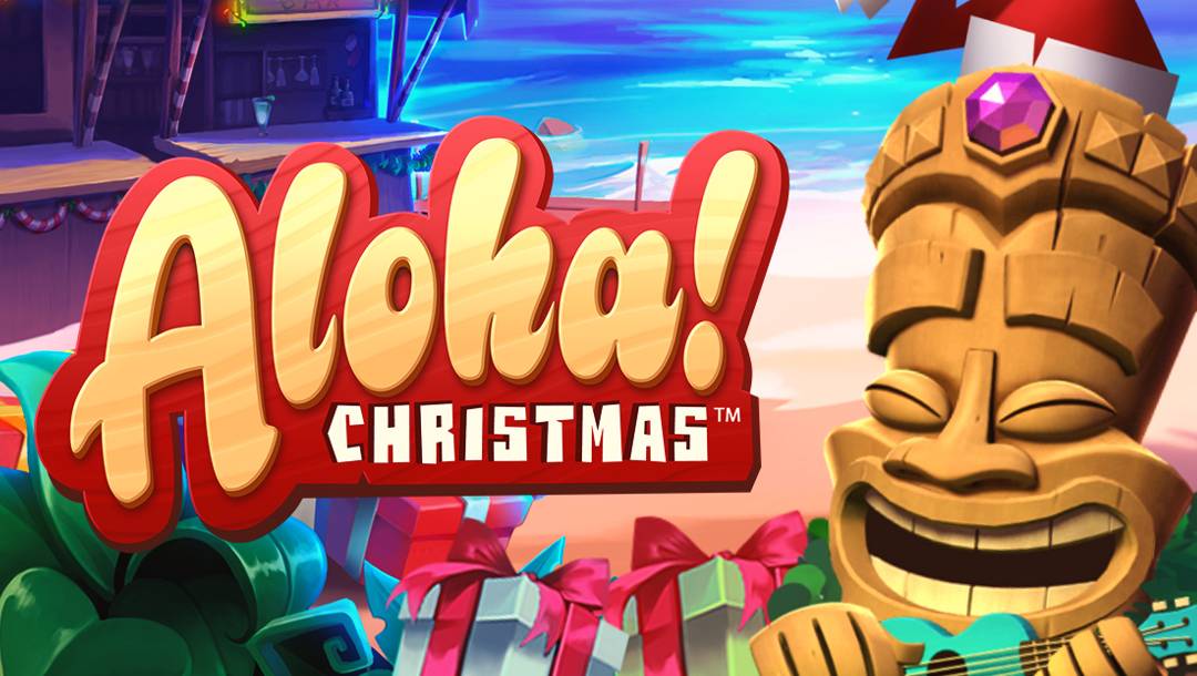 A screenshot of the Aloha! Christmas header image. It features a smiling tiki statue in a Santa hat with "Aloha! Christmas" text, beach background, and wrapped gifts below.