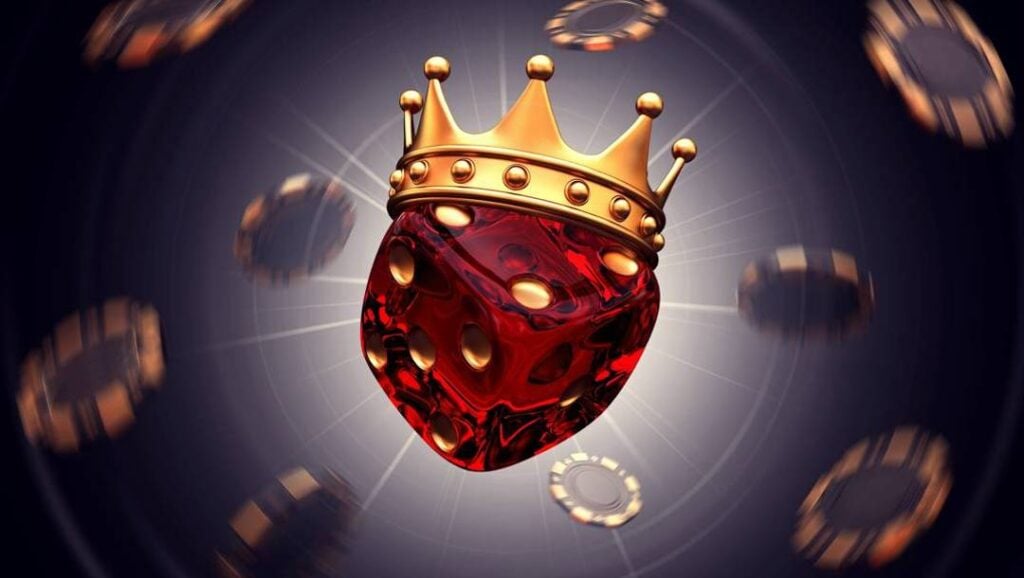 A glowing, translucent red die wearing a golden crown is suspended among blurred casino chips floating against a dark background.