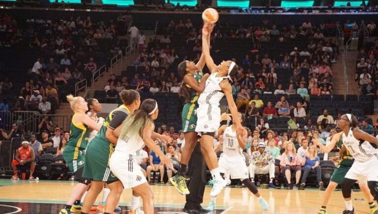 A tipoff of a WNBA game.