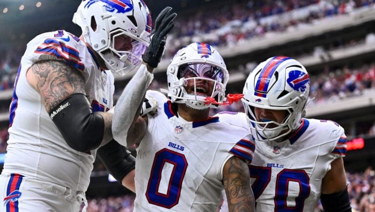 Buffalo Bills wide receiver Keon Coleman (0) celebrates with teammates after scoring a touchdown in the third quarter during an NFL football game, Sunday, Oct 6, 2024 in Houston.