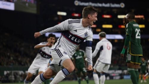 Vancouver Whitecaps midfielder Ryan Gauld scores a goal during the first half of an MLS soccer match against the Portland Timbers.
