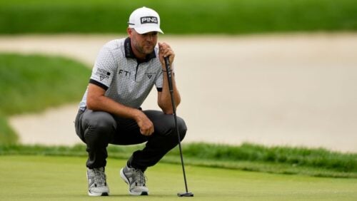 Corey Conners, of Canada, lines up a putt on the eighth hole during the third round of the U.S. Open golf tournament at Oakmont.
