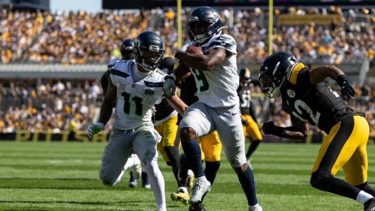 Seattle Seahawks running back Kenneth Walker III (9) crushes for a touchdown during an NFL football game, Sunday, Sept. 14, 2025, in Pittsburgh.
