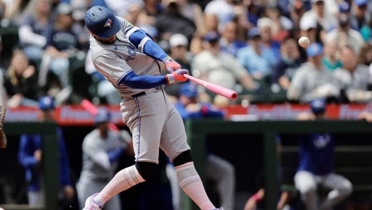 Toronto Blue Jays' George Springer hits a three-run home run off Seattle Mariners starting pitcher Bryce Miller during the fifth inning of a baseball game Sunday, May 11, 2025, in Seattle.