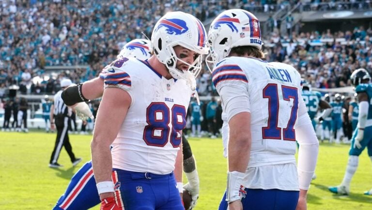 Buffalo Bills quarterback Josh Allen (17) celebrates his touchdown with tight end Dawson Knox (88) during the second half of an NFL wild-card playoff football game against the Jacksonville Jaguars Sunday, Jan. 11, 2026, in Jacksonville, Fla.
