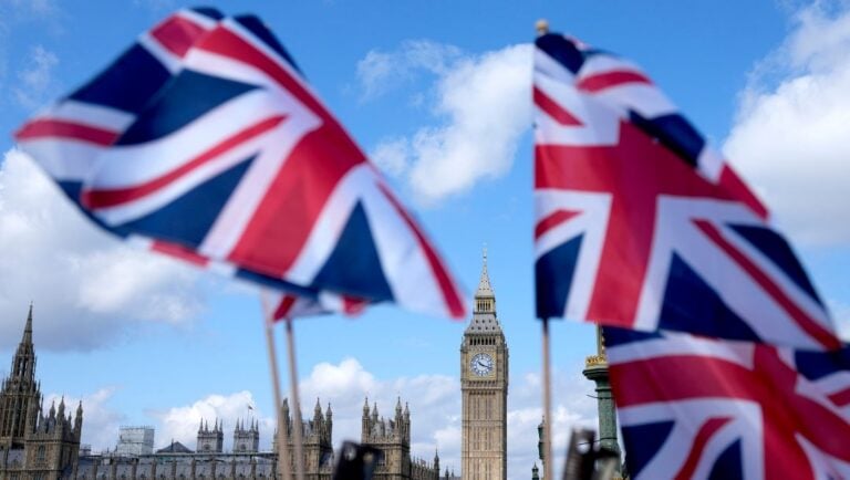 Union Jack flags are seen surrounding the Elizabeth Tower, known as Big Ben, beside the Houses of Parliament in London, Friday, June 24, 2022.