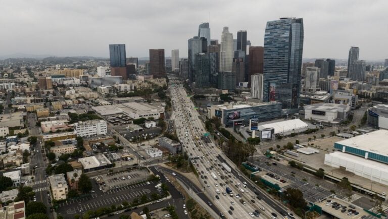 This aerial view shows traffic moving along the 110 Freeway in downtown Los Angeles, Tuesday, Sept. 5, 2023.
