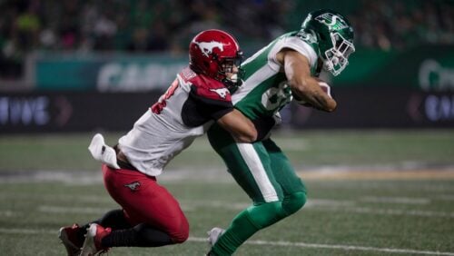 Calgary Stampeders defensive back Branden Dozier (3) tackles Saskatchewan Roughriders wide receiver Kyran Moore (85) during the second half of CFL football action in Regina on Saturday, October 9, 2021.