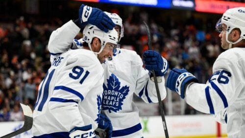Toronto Maple Leafs center John Tavares (91) is greeted by teammates after scoring the game-winning goal during overtime of an NHL hockey game against the Anaheim Ducks, Monday, March 30, 2026, in Anaheim, Calif.