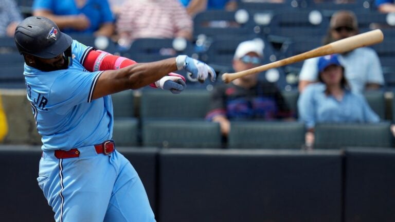 Toronto Blue Jays' Vladimir Guerrero Jr. loses his bat after swining at a pitch from Tampa Bay Rays' Kevin Kelly during the seventh inning of a baseball game Thursday, Sept. 18, 2025, in Tampa, Fla.