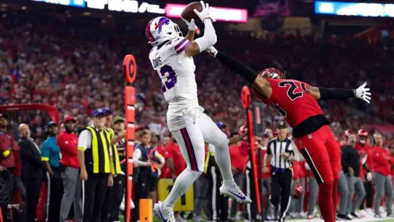 Buffalo Bills wide receiver Gabe Davis (13) catches a pass as Houston Texans cornerback Derek Stingley Jr. (24) defends during an NFL football game, Thursday, Nov. 20, 2025, in Houston.