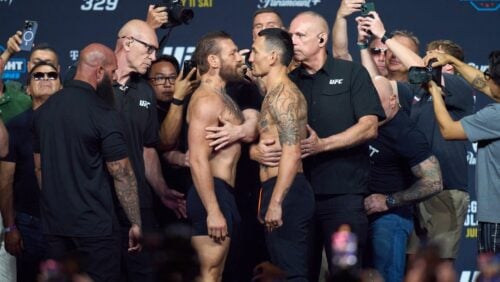 Conor McGregor, center left, and Max Holloway face off a ceremonial weigh-in for the UFC 329 mixed martial arts event Friday, July 10, 2026, in Las Vegas.