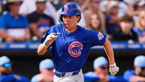 Chicago Cubs' Brett Bateman runs home to score on a two-run single hit by James Triantos during the fifth inning of a spring training baseball game against the Kansas City Royals, Monday, Feb. 23, 2026, in Surprise, Ariz.